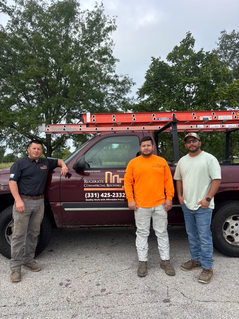 The Rugerios Roofing crew in front of their work truck in Aurora, IL